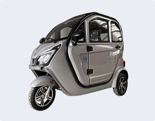 A compact, enclosed three-wheeled electric vehicle is shown on a light background. Text on the right offers vehicle service and workshop information.